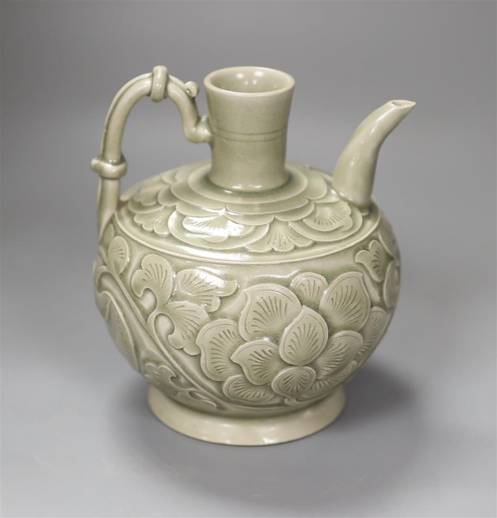 A Chinese carved celadon ewer, 16cm high